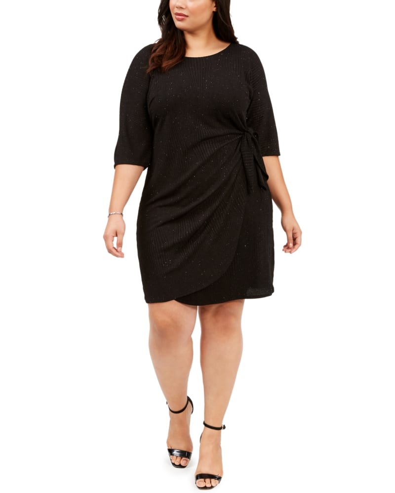 Front of a model wearing a size 1X Robbie Bee Women's Plus Glitter Knit Sarong Dress Black Size 1X in Black by Robbie Bee. | dia_product_style_image_id:313204